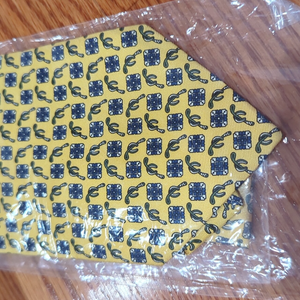 Yellow horse bit power tie All silk in packaging.